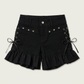 Two Moody Originals: Pretty Dangerous Shorts in black denim with custom ruffle hems, skull embellishments, and studded ribbon side lacing.