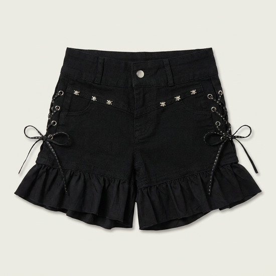 Two Moody Originals: Pretty Dangerous Shorts in black denim with custom ruffle hems, skull embellishments, and studded ribbon side lacing.