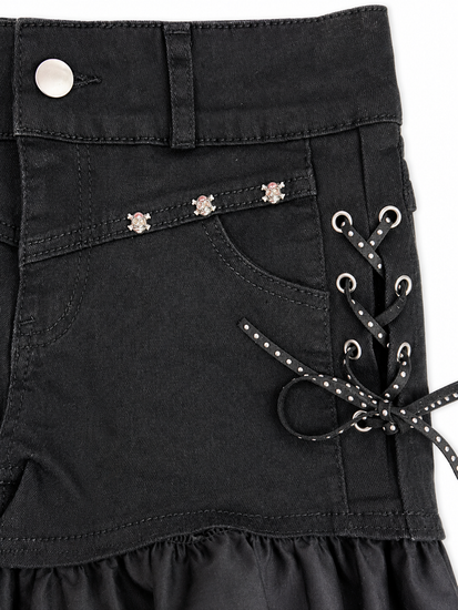 Detailed view of Two Moody Originals: Pretty Dangerous Shorts featuring studded ribbon side lacing, metal grommets, and skull embellishments.