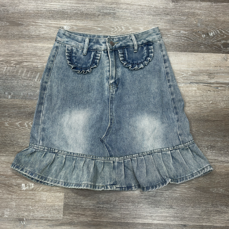 Front flat lay of the Two Moody Originals: Ruffle Flare Jean Skirt with Angled Front in size M with ruffle hem and ruffle faux pockets.