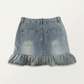 Back flat lay of the Two Moody Originals: Ruffle Flare Jean Skirt in XL with ruffle hem.
