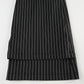 Overlapping view of pant hems from Y2K Business Chic Trousers, emphasizing clean tailoring and stripe alignment.
