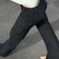 Back angle of model wearing Y2K Business Chic Trousers with streetwear styling and flattering pinstripe cut.