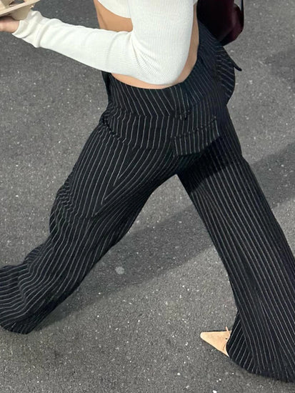 Back angle of model wearing Y2K Business Chic Trousers with streetwear styling and flattering pinstripe cut.
