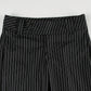 Close-up of waistband on Y2K Business Chic Trousers featuring diagonal stripe pattern and double-button closure.