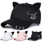 All-Star Kitty Baseball Cap shown in black, white, and pink with plush cat ears and safety pin charms.