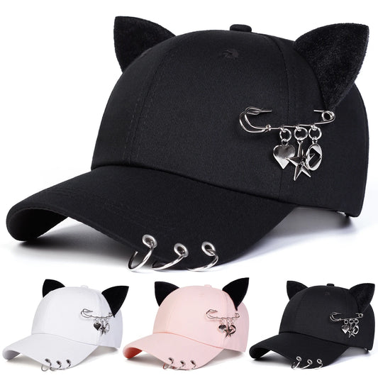 All-Star Kitty Baseball Cap shown in black, white, and pink with plush cat ears and safety pin charms.