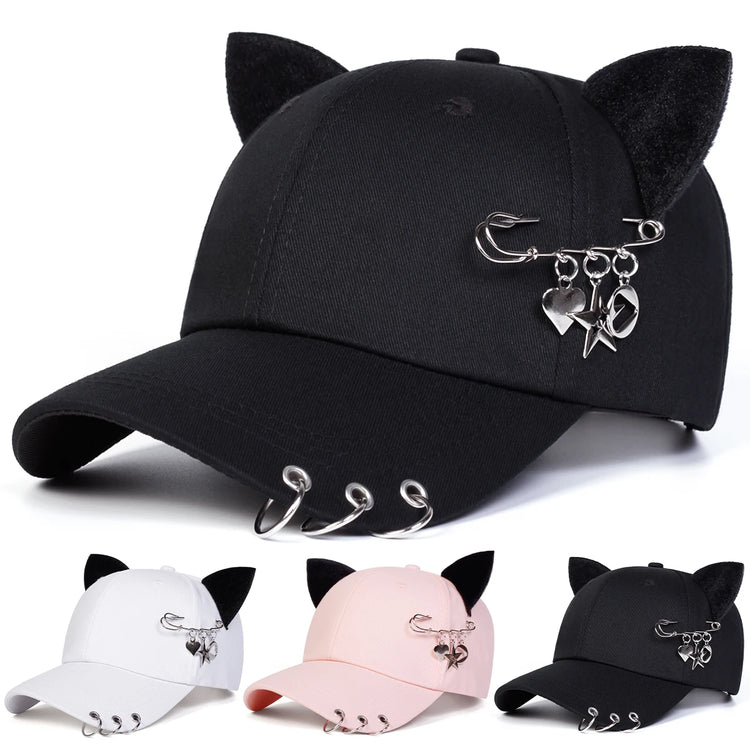 All-Star Kitty Baseball Cap shown in black, white, and pink with plush cat ears and safety pin charms.