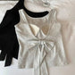 Black and gray Backstage Bow Backless Tanks are displayed together, with the gray version showing the back and the black version showing the front.