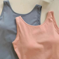 Top front view of the blue and pink Backstage Bow Backless Tanks.