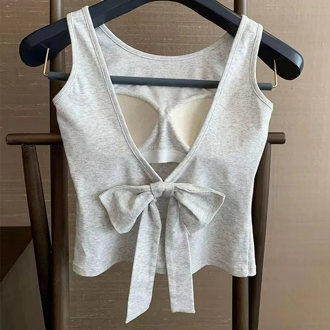 Gray Backstage Bow Backless Tank hanging to display the oversized bow.