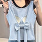 Model showing the back of the Backstage Bow Backless Tank in blue to highlight the open back and bow.