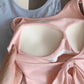 Close-up of the pink Backstage Bow Backless Tank, highlighting the open back and built-in bra, with the front of the blue version in the back.
