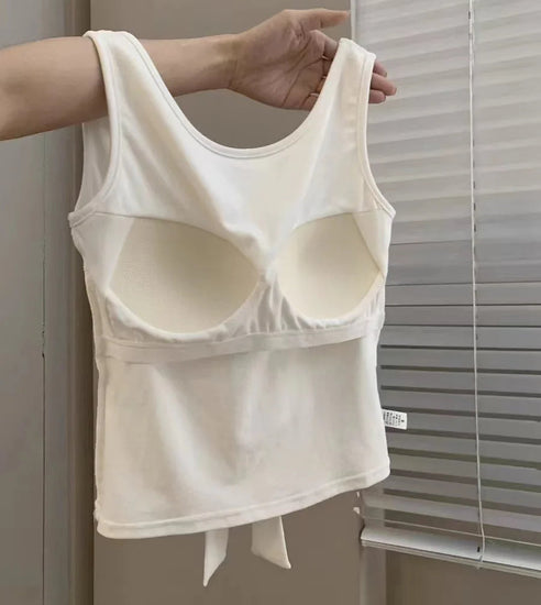 Interior view of the built-in bra inside the white Backstage Bow Backless Tank.