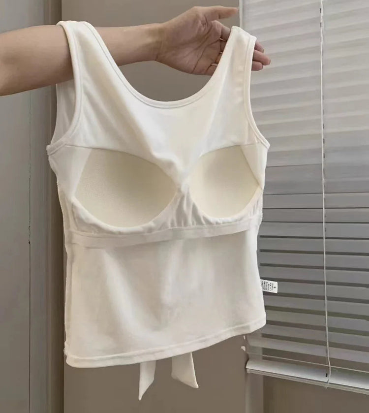 Interior view of the built-in bra inside the white Backstage Bow Backless Tank.