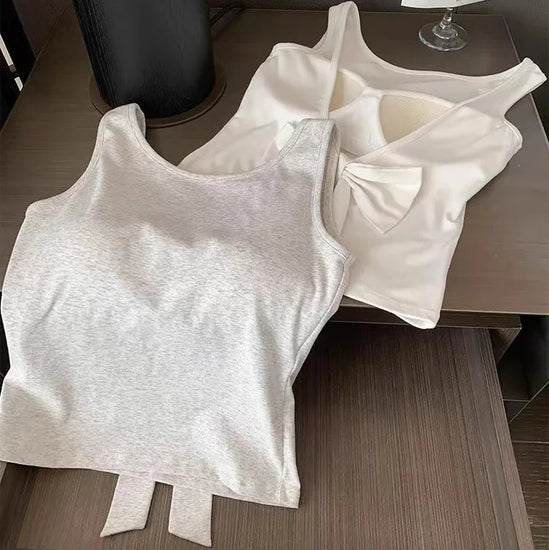 Backstage Bow Backless Tank in white and gray laid flat, the gray displaying the front and the white displaying the back.