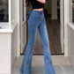 Model wearing the Dark Blue Backstage Bow Flare Jeans, angled front view.