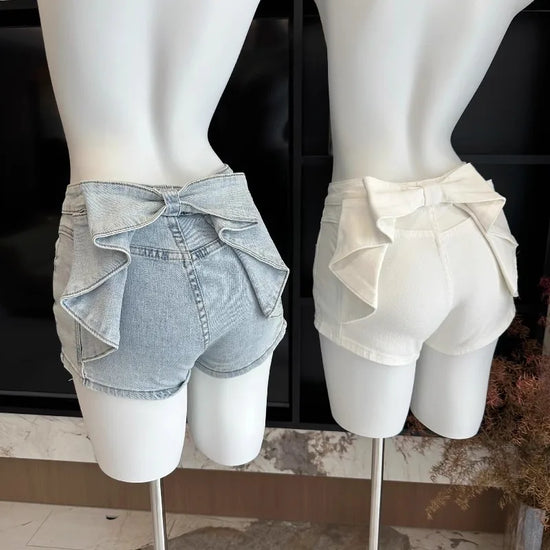 Back view of the white and light blue Backstage Bow Shorts displaying the oversized bow detail.