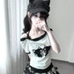 Three-quarter view of the model wearing the Bandaged Kitties Off-Shoulder Top featuring the off-shoulder neckline, adjustable halter strap, and Yami Kawaii-inspired bandaged kitty graphic.