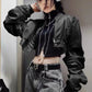 Model wearing the Blackout Zip Top layered under a black bomber jacket with grey acid-washed jeans.