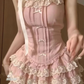 Close-up front view of the Blushing Belle Skort Set, highlighting the lace and ruffle details.