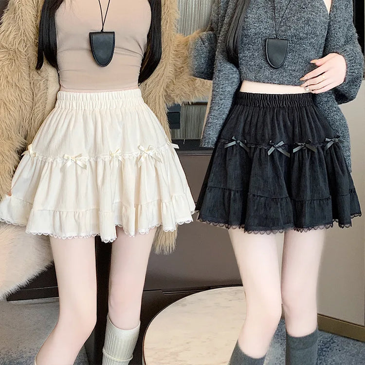 Two models wearing the apricot and black Bow Peep Mini Skorts.