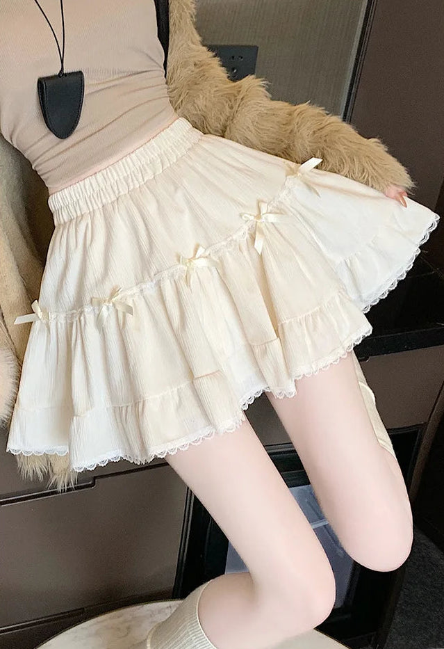 Close-up of Bow Peep Mini Skort Apricot ruffle and pleat details.