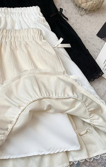 The three colors of the Bow Peep Mini Skorts stacked on top of each other with the apricot version on top, showing the shorts underneath.