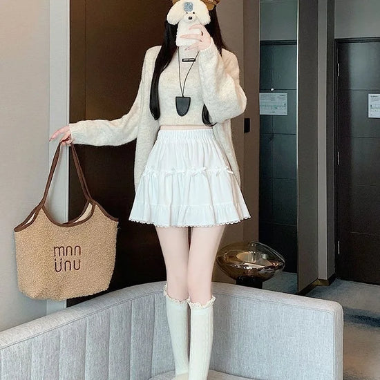 Front view of a model wearing the Bow Peep Mini Skort in White.