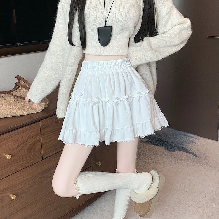 Front view of Bow Peep Mini Skort in White with pleats and bow details.