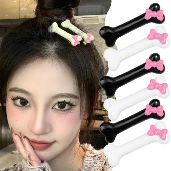 Model wearing the Bowtiful Bones Hair Clips, with additional black and white bone-shaped clips displayed beside her, all featuring sweet pink bow accents.