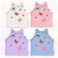 Charm Collector Tank cover showing the white, dusty pink, light lavender, and pale periwinkle blue colorways in a four-piece flat lay.