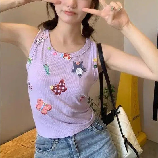 Model wearing the light lavender Charm Collector Tank and making a peace sign indoors.