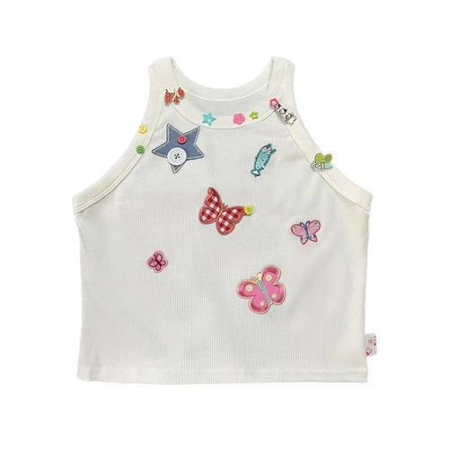 White Charm Collector Tank shown in a front flat lay with colorful butterfly, star, animal, and button embellishments.