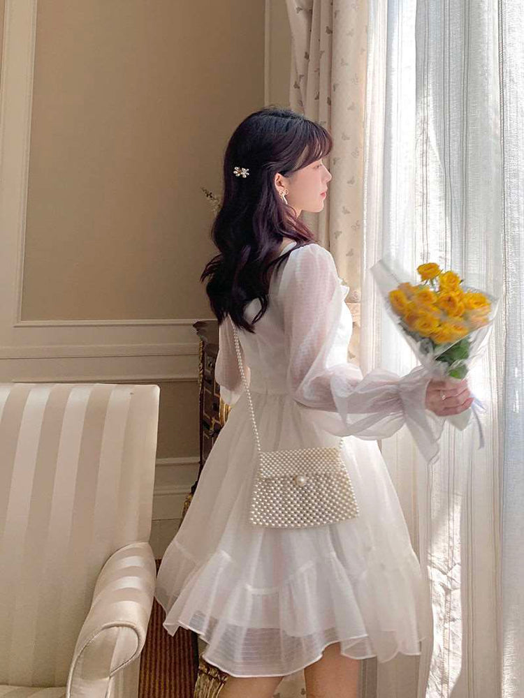 Cloudlight Fairy Dress in slight motion showing the A-line twirl, airy fabric, and back of the dress