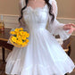 Model wearing the Cloudlight Fairy Dress with yellow bouquet, front view