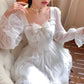 Model sitting in the Cloudlight Fairy Dress with added golden sparkles
