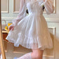 Model posing in the Cloudlight Fairy Dress with added golden sparkles