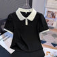Front view of the Collar Me Cute Polo Top in black with white collar