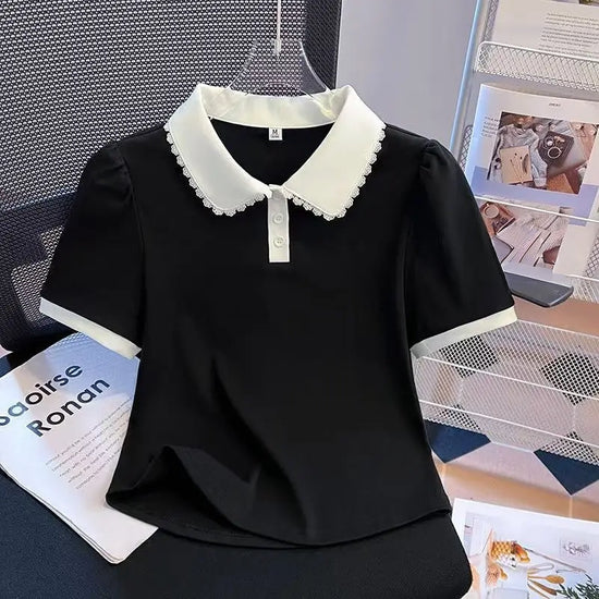Front view of the Collar Me Cute Polo Top in black with white collar