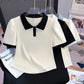 Front view of the Collar Me Cute Polo Top in white with black collar, shown with the black-with-white and white-with-blue colorways behind it.