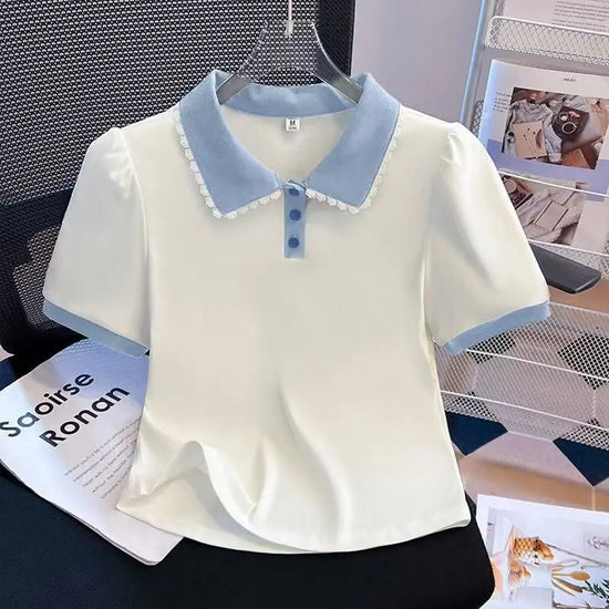 Front view of the Collar Me Cute Polo Top in white with blue collar