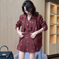 Side view of model adjusting dark red Colorful Butterfly Dreams Embroidered Suit with butterfly embroidery detail