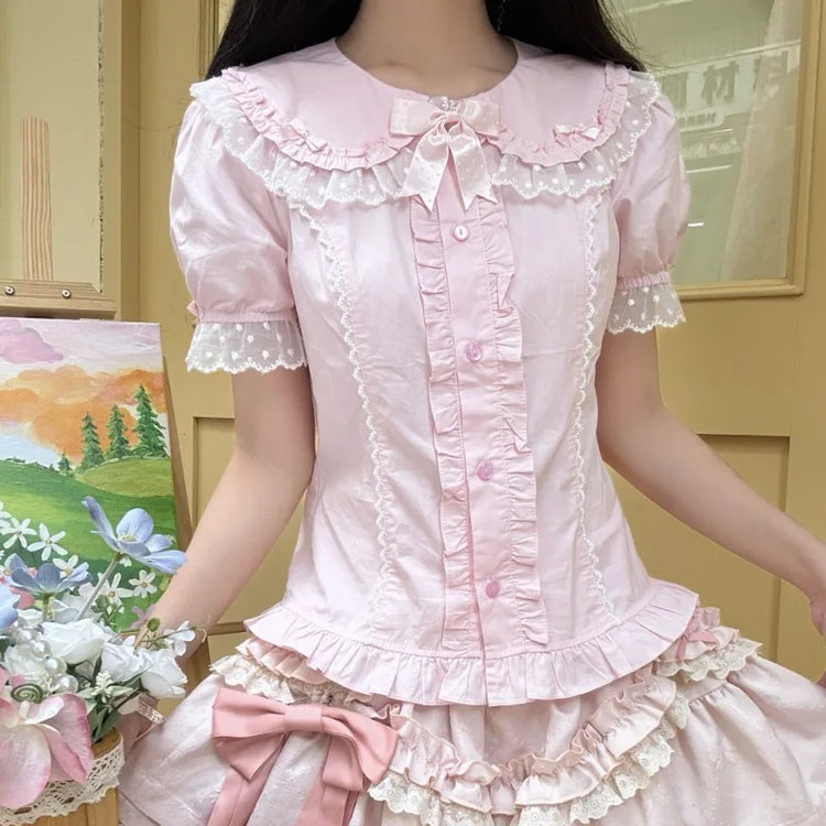 Model wearing the pink Darling Honey Bear Blouse with matching ruffled skirt and flowers.