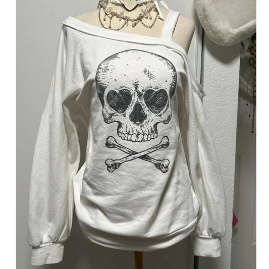 Dead Cute Off-Shoulder Top on mannequin with skull graphic and off-shoulder neckline