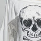 Detail view of skewed off-shoulder neckline and fabric texture on Dead Cute Off-Shoulder Top