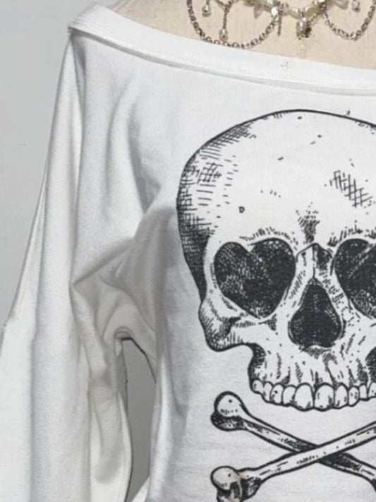Detail view of skewed off-shoulder neckline and fabric texture on Dead Cute Off-Shoulder Top