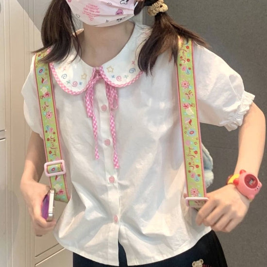 Doodle Darling Collar Blouse in white with pastel embroidered collar, pink gingham trim, and puff sleeves