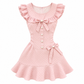A flat lay of the Dotted Darling Dress, a pink polka-dot mini dress, on a white background.