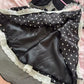 Inside view of the Dotted Doll Lace Skort showing its smooth black built-in shorts beneath the polka-dot and lace layers.